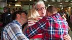 Ray Cole hugging family