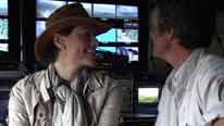 Kate and Jonathan in front of webcam monitors