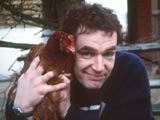 Man holding a hen