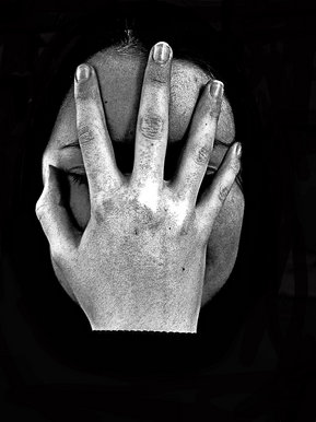 Hand to face