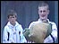 Boys carry sandbags and prepare for the worst