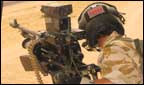 A British troop on patrol in a helicopter.