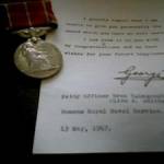 The medal and letter Olive recieved from the King at the end of the war. The medal and letter Olive recieved from the King at the end of the war.
