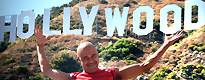 L in front of the Hollywood sign