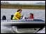 Boy driving a powerboat 66