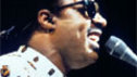 Stevie Wonder performs at the piano