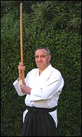 Man holding wooden training sword