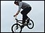 A BMX rider gets some air at LibJam