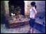 Woman surveys flood damage