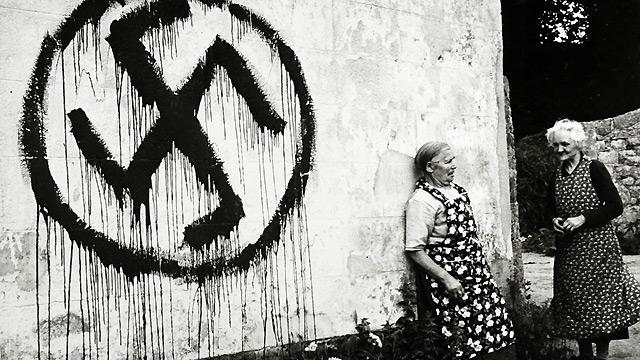 Patriots on the island of Jersey tarred the houses of collaborators with a swastika. This was counteracted by the Germans who painted hundreds of houses with the swastika, including the home of these two elderly ladies in 1944.