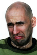 Man looking exaggeratedly sad or disgusted