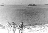 British soldiers making their way through minefields, as the Italian fleet surrenders