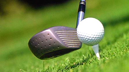A golf club and ball
